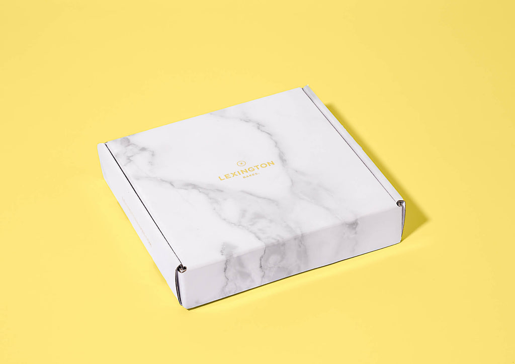 Lexington Bakes Promise - White Marble Box on Yellow Background